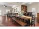 Spacious open-concept dining room with hardwood floors, statement wall, and adjacent living room at 1429 Fletcher Ave, Indianapolis, IN 46203