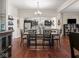 Spacious dining room with hardwood floors, open to kitchen and seating, perfect for entertaining at 1429 Fletcher Ave, Indianapolis, IN 46203