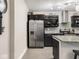 Modern kitchen with stainless steel appliances, granite countertops, and tile backsplash at 1429 Fletcher Ave, Indianapolis, IN 46203