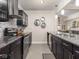 Contemporary kitchen features granite countertops, stainless steel appliances and modern cabinetry at 1429 Fletcher Ave, Indianapolis, IN 46203