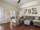Cozy living room with hardwood floors, a comfortable sofa, and access to other rooms creating a welcoming space at 1429 Fletcher Ave, Indianapolis, IN 46203