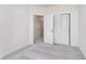 Bright bedroom featuring plush gray carpet, white walls, and closet with sliding doors at 14544 Hanford Ln, Carmel, IN 46074