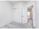 Neutral bedroom featuring plush gray carpet, white walls, closet, and bright lighting at 14544 Hanford Ln, Carmel, IN 46074