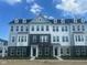Modern townhomes feature mixed material exteriors, multiple stories, and ample windows at 14544 Hanford Ln, Carmel, IN 46074