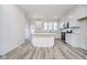 Bright, eat-in kitchen featuring white cabinets, stainless steel appliances, and durable countertops at 14544 Hanford Ln, Carmel, IN 46074