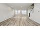 Open-concept living room featuring hardwood floors, recessed lighting, and a staircase at 14544 Hanford Ln, Carmel, IN 46074