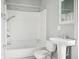 A classic bathroom features a shower tub, toilet, and sink at 1509 Sycamore St, Columbus, IN 47201