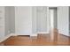 The bedroom's gleaming hardwood floors extend throughout the space at 1509 Sycamore St, Columbus, IN 47201