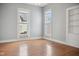 Bright bedroom with two large windows and hardwood floors at 1509 Sycamore St, Columbus, IN 47201