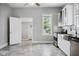 Modern kitchen with stainless appliances and stylish gray flooring at 1509 Sycamore St, Columbus, IN 47201