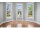 Inviting living room featuring a bay window, providing plenty of natural light at 1509 Sycamore St, Columbus, IN 47201