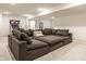 Spacious finished basement featuring plush sectional sofa, neutral walls, and carpet at 15655 Woodford Dr, Westfield, IN 46074