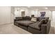 Finished basement with large sectional sofa and neutral carpet at 15655 Woodford Dr, Westfield, IN 46074