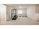Finished basement with gym equipment, a sports net, and neutral carpet at 15655 Woodford Dr, Westfield, IN 46074