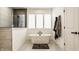Bright bathroom featuring a freestanding tub, clean lines, a tiled accent wall, and natural light at 15655 Woodford Dr, Westfield, IN 46074