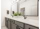 Double vanity bathroom with gray cabinets, quartz countertop, and modern faucets at 15655 Woodford Dr, Westfield, IN 46074