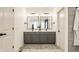 Bathroom with double vanity, modern fixtures, and a bold patterned floor, blending style and functionality at 15655 Woodford Dr, Westfield, IN 46074