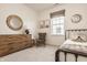 Bedroom with natural wood dresser, rocking chair, and sports-themed decor at 15655 Woodford Dr, Westfield, IN 46074