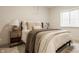 This bedroom features a comfortable bed, neutral decor, and natural light from the window at 15655 Woodford Dr, Westfield, IN 46074