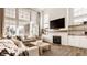 Bright living room featuring a fireplace, large windows, and stylish furnishings at 15655 Woodford Dr, Westfield, IN 46074