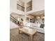 Open-concept living room with high ceilings, wood floors, and modern decor at 15655 Woodford Dr, Westfield, IN 46074