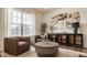 Cozy sitting area with a rug, decorative coffee table, and light fixtures at 15655 Woodford Dr, Westfield, IN 46074