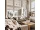 Bright and airy living room with large windows, comfortable seating, and modern decor at 15655 Woodford Dr, Westfield, IN 46074