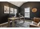 Stylish home office with dark walls, a vaulted ceiling, and modern furnishings at 15655 Woodford Dr, Westfield, IN 46074