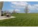 Expansive backyard with a patio and views of the surrounding green space at 16080 Cabin Hill Dr, Noblesville, IN 46060