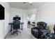 Comfortable bedroom features plush reclining chair with easy access to nearby hall at 16080 Cabin Hill Dr, Noblesville, IN 46060