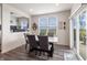Bright dining area featuring modern table and chairs next to sliding glass door to outdoor patio at 16080 Cabin Hill Dr, Noblesville, IN 46060