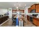 Open-concept kitchen features granite countertops, stainless steel appliances, and a spacious island with seating at 16080 Cabin Hill Dr, Noblesville, IN 46060