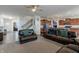 Large living room boasts an open layout with a kitchen, dining area, and natural light at 16080 Cabin Hill Dr, Noblesville, IN 46060