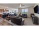 Open-concept living room with large windows and a comfortable seating arrangement at 16080 Cabin Hill Dr, Noblesville, IN 46060