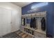 Well-organized mudroom boasts storage, hooks, seating and a bright, welcoming ambiance at 16080 Cabin Hill Dr, Noblesville, IN 46060