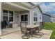 Covered patio with outdoor seating, perfect for relaxing and entertaining at 16080 Cabin Hill Dr, Noblesville, IN 46060
