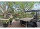 Backyard with wooden deck, dining table, and a view of the garden at 165 N 9Th St, Zionsville, IN 46077