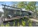 Backyard with a deck, pergola, and a cushioned hanging chair at 165 N 9Th St, Zionsville, IN 46077