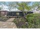 Charming backyard with a patio, landscaping, and a mix of stone and gravel paths at 165 N 9Th St, Zionsville, IN 46077