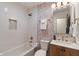 Updated bathroom with a tub, decorative tile, and modern fixtures at 165 N 9Th St, Zionsville, IN 46077