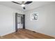 Sunlit bedroom with hardwood floors, large window, and closet with shelving at 165 N 9Th St, Zionsville, IN 46077