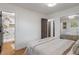Bright bedroom with ensuite bathroom access and mirrored closet doors create a comfortable and functional space at 165 N 9Th St, Zionsville, IN 46077