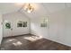 Bright bedroom with wood flooring and access to a door for plenty of natural light at 165 N 9Th St, Zionsville, IN 46077