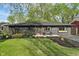 Charming home with a well-manicured lawn, tasteful landscaping, and updated paint at 165 N 9Th St, Zionsville, IN 46077
