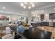 Open-concept living space seamlessly connects the living room, dining area, and kitchen for modern living at 165 N 9Th St, Zionsville, IN 46077