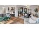 An open living space featuring bar seating, a dining area, and a comfortable living room at 165 N 9Th St, Zionsville, IN 46077