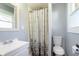 Bathroom featuring a shower with a snowflake shower curtain, toilet and vanity at 166 N Post Rd, Indianapolis, IN 46219