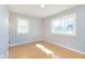 Light-filled bedroom with two windows offering plenty of natural light at 166 N Post Rd, Indianapolis, IN 46219