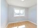 Bright bedroom with two windows and wood floors at 166 N Post Rd, Indianapolis, IN 46219