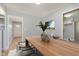 Bright dining room featuring modern table and seating with stylish decor and open doorway at 166 N Post Rd, Indianapolis, IN 46219